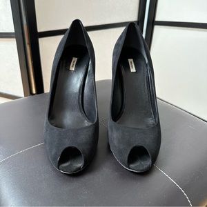 Woman’s Miu Miu Black Prep Toe Pumps
